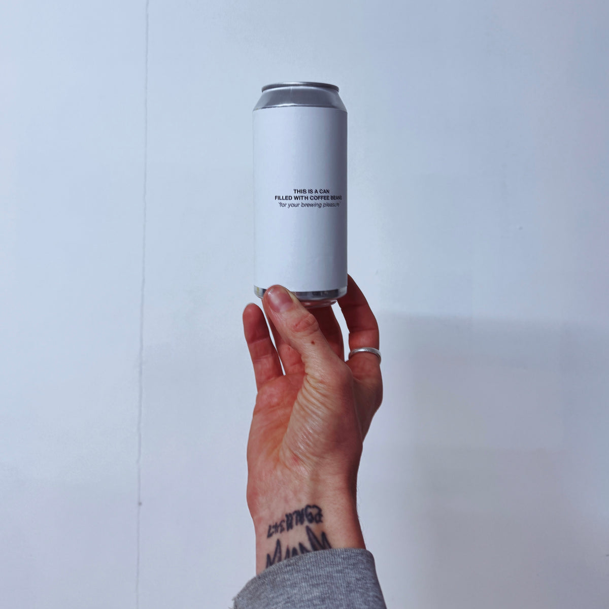 A CAN FILLED WITH COFFEE BEANS packshot